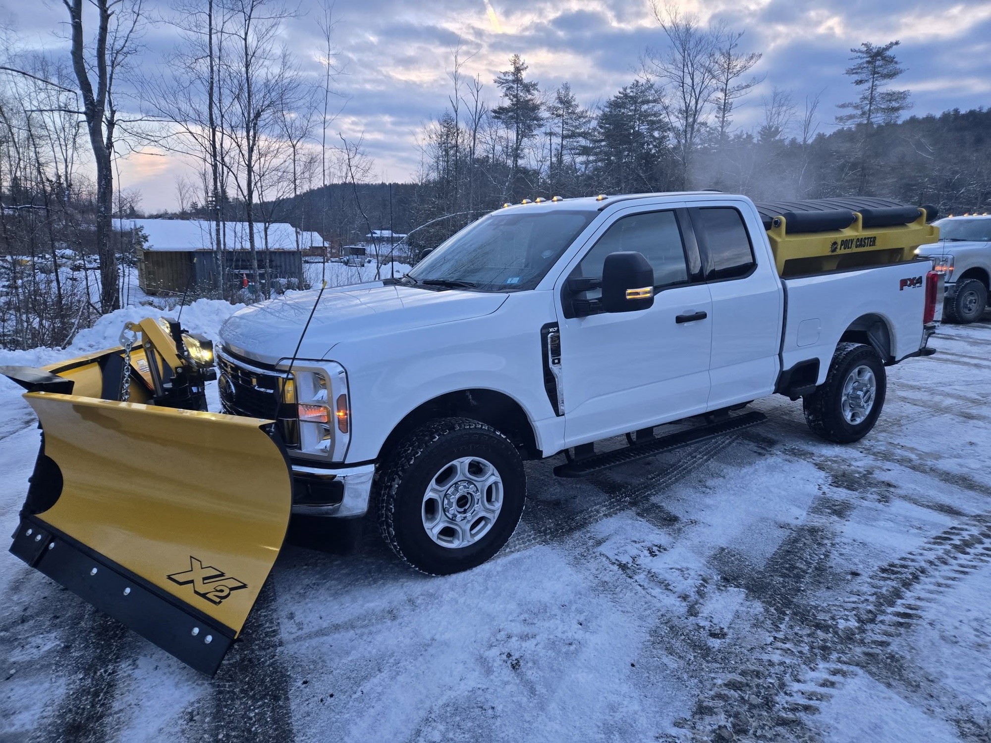 Plow truck clearing a road after a heavy snowfall